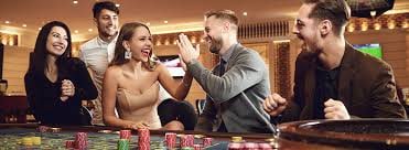 Live roulette table with dealer and players